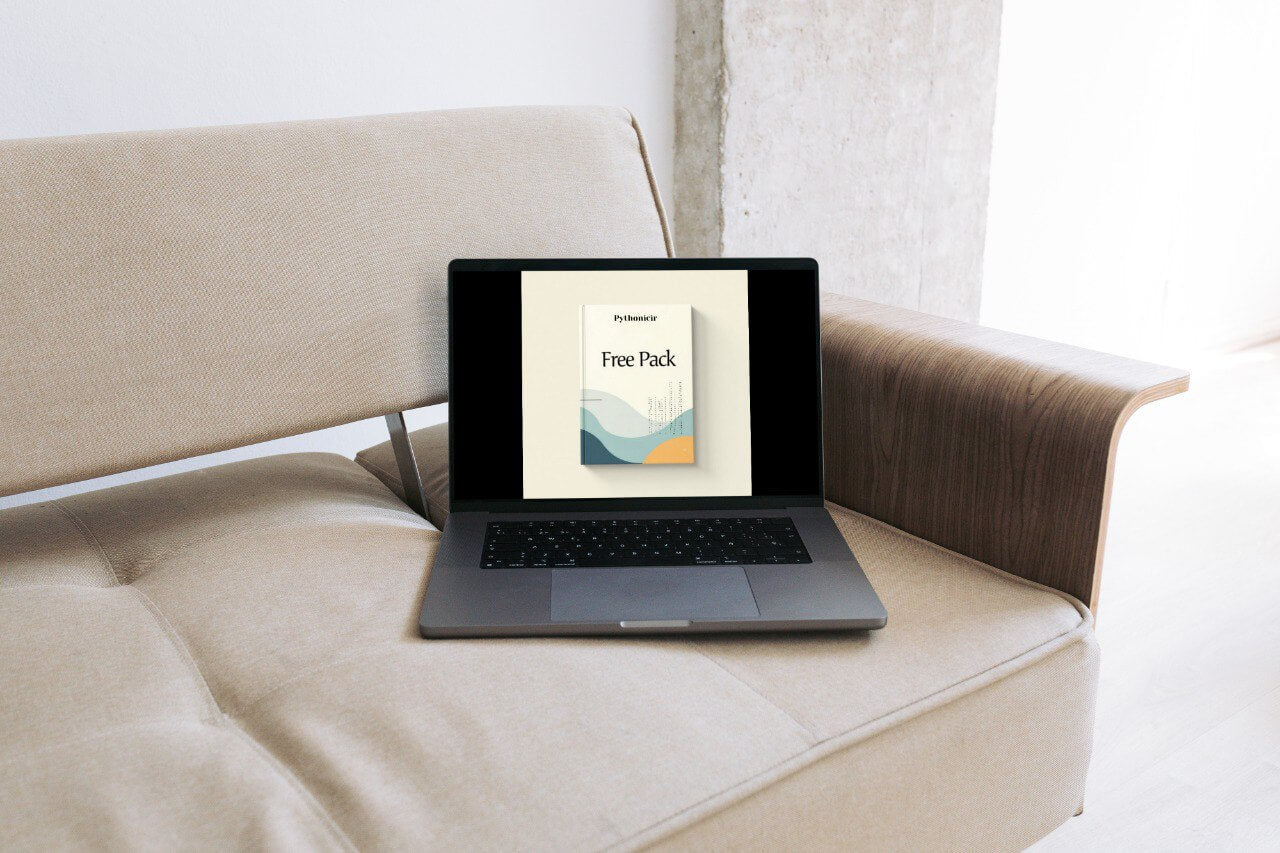Laptop on a beige sofa with a screen displaying a 'Free Pack' offer.