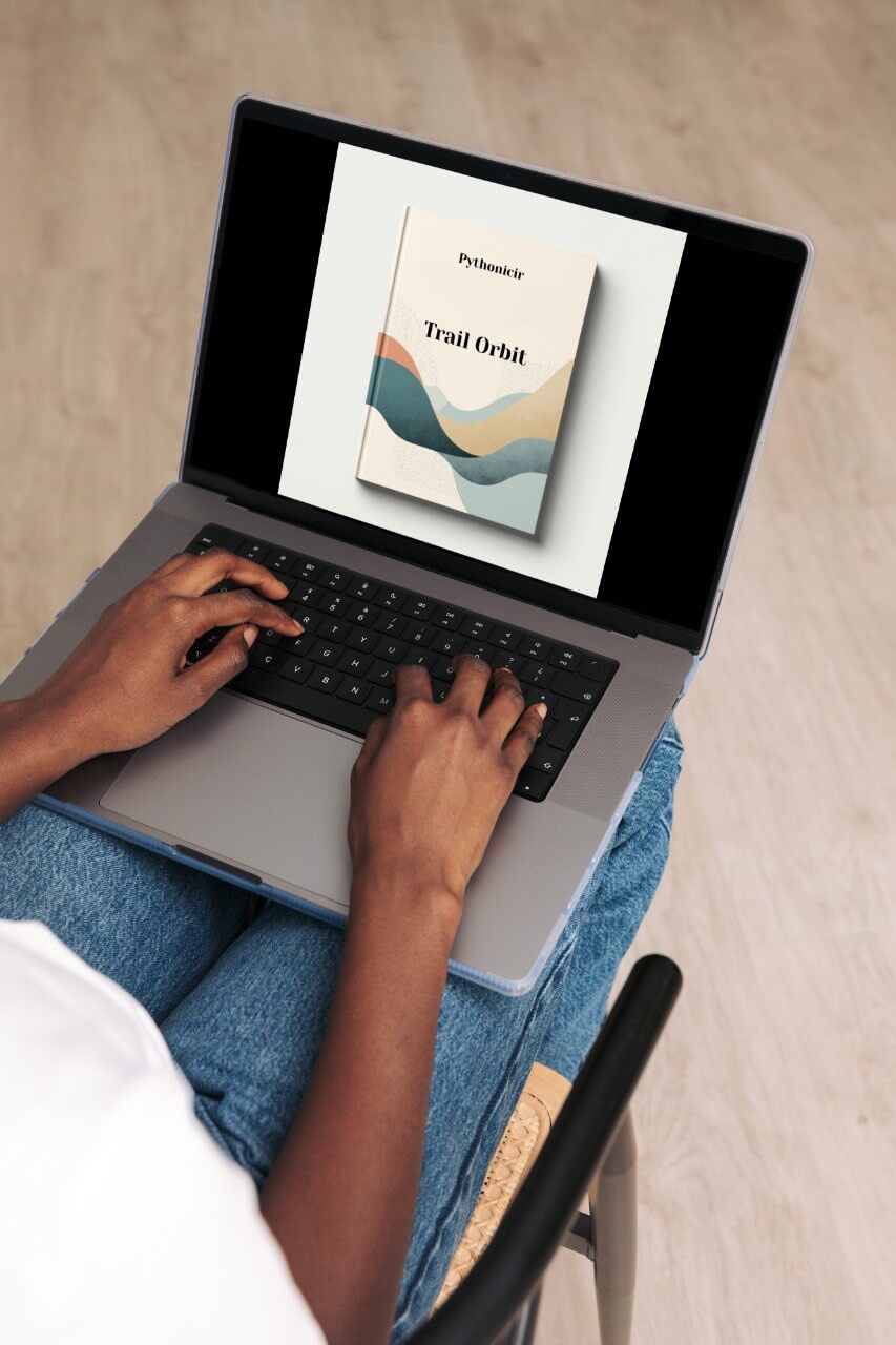 Person using a laptop with a course cover displayed on the screen, sitting on a chair.